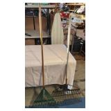 2 metal rakes with wood handles