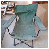 Green foldable-portable camping chair. Has a