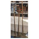 Metal rakes and hoe, middle rake is loose, wood
