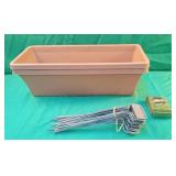 2 plastic planters 18 x 7.5 x 5.5. Has cracks on