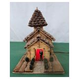 Church made of matchsticks pinecones and wood,