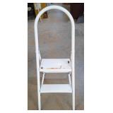 White metal foldable 2 step ladder. 41.75". Holds