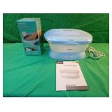 Homedics ParaSpa Plus with wax refill. Comes on.