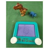 Pocket etch a sketch and 2 dinosaurs toys