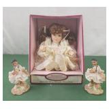 Animated bisque porcelain musical doll and 2