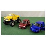2 PT Cruisers and a jacked up Chevy truck toy
