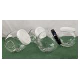 3 white 1 black small glass jars with lids