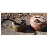 2 galvanized gas cans. Has liquid in them.