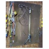 Rachet straps. Contents on pegboard