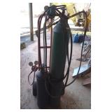 Acetylene and oxygen tank on hand truck. Tires