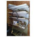 Contents on shelves - piping, hardware, parts,