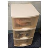 Plastic bins with wheels with hair ties, hair