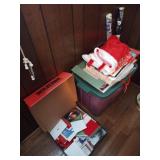 Box of cards, wrapping paper and stockings. Tote