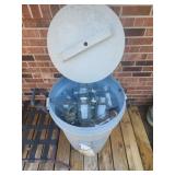 Rubbermaid trash can full of Mason jars