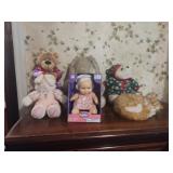 Stuffed animals and baby doll