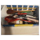 Kitchen utensils including spatulas, tongues and