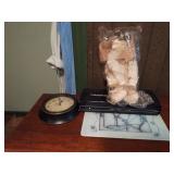 Clock, cutting block, candles and a cloth angel