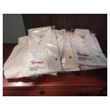 12 uniform blouses. Unknown size. New. 18 gal