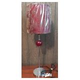 Silver and red lamp