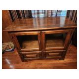 39x31x20 glass cabinet TV stand. Has some scuff