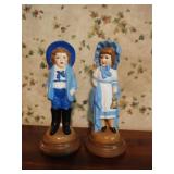Vintage hand painted ceramic boy and girl statues