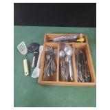 Wooden organizer of assorted utensils