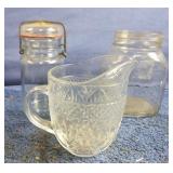 Glass creamer, glass jar with lid and an oval