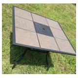Outdoor table with removable tiles