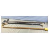 2 wood canes and 1 metal adjustable cane