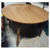 Round wood table with a leaf. 42-54 x 30" tall
