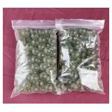 2 bags of green glass balls