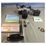 Camera case with Minolta camera and accessories