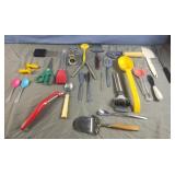 Various kitchen utensils including a pizza