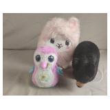 Hatchimal and a stuffed bear