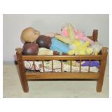 Wooden Doll Bed Full of Dolls