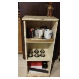 Small wood book shelf with contents including