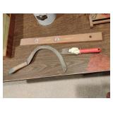 Level, sickle and a scraper