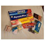 Opened foil, muffin liners, matches, straws