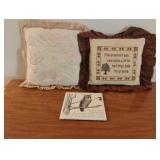2 handmade small throw pillows and an owl wall