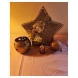 Brass candle holder, gold colored ornament and