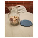 Seashells in vase and shell soap dish