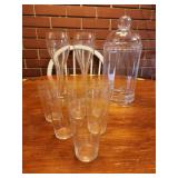 Plastic jar with lid and glasses