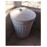 Plastic garbage can with lid with potting mix and