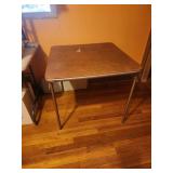 Folding table ripped vinyl top card table