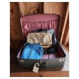 Blue vintage suitcase with extra bags inside