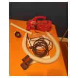 Dirt Devil hand vac with accessories. Powers on