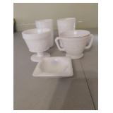 Vintage milk glass mugs and an ash tray