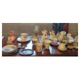 Vintage figurines, bells and an oil lamp