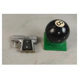 Vintage plastic 8 ball lighter and a gun shaped Vintage plastic 8 ball lighter and a gun shaped