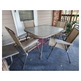 28x40x33 patio table and 4 folding chairs